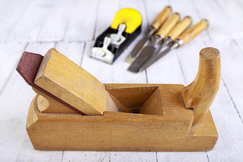 Wood Planer, Chisels and Drill Bits on a Wooden Table. Carpentry