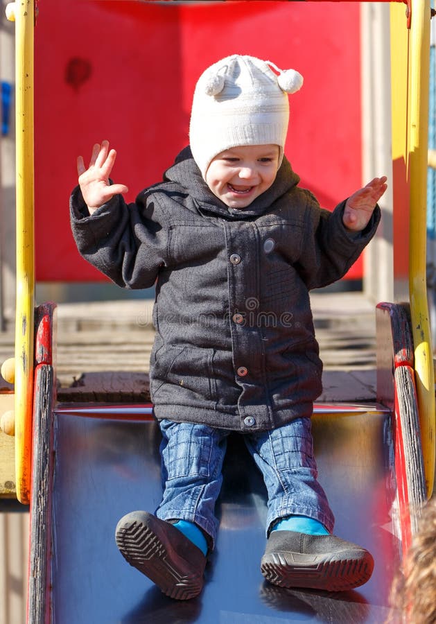 Two Years Old Son is Sliding Down a Roller Coaster Stock Image Image