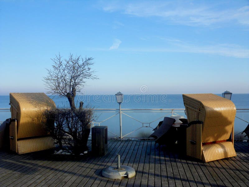 Two yellow beach chairs. stock photo. Image of pier 128409760