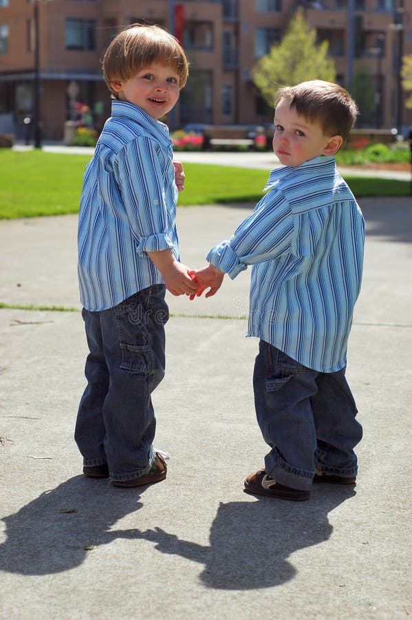 Two Young Brothers Holding Hands Stock Image Image of happy, child 5251999