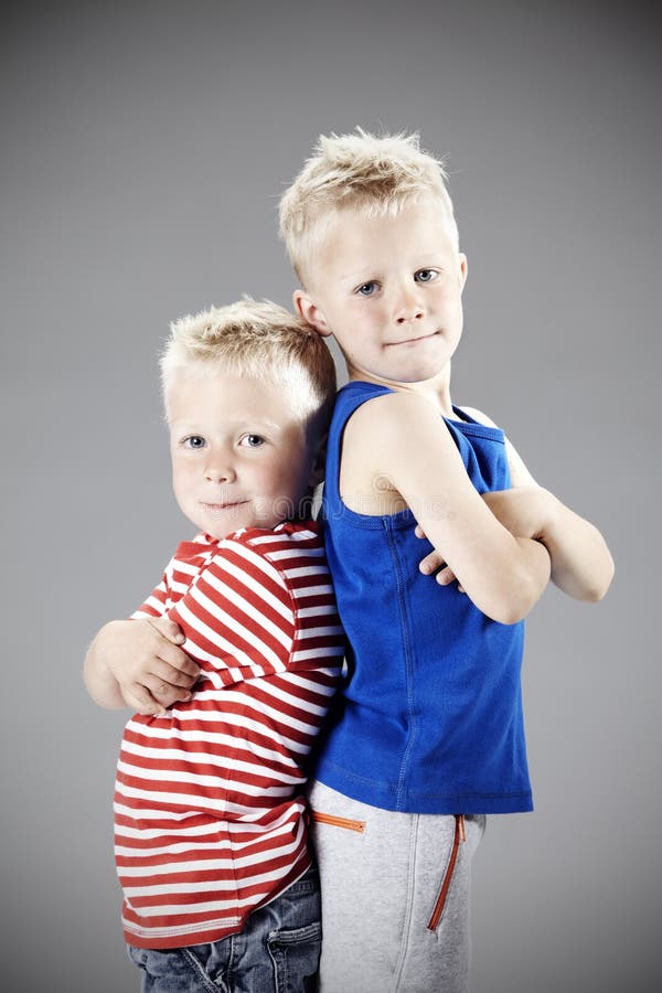Two Young Brothers in Studio Stock Photo Image of little, leaning
