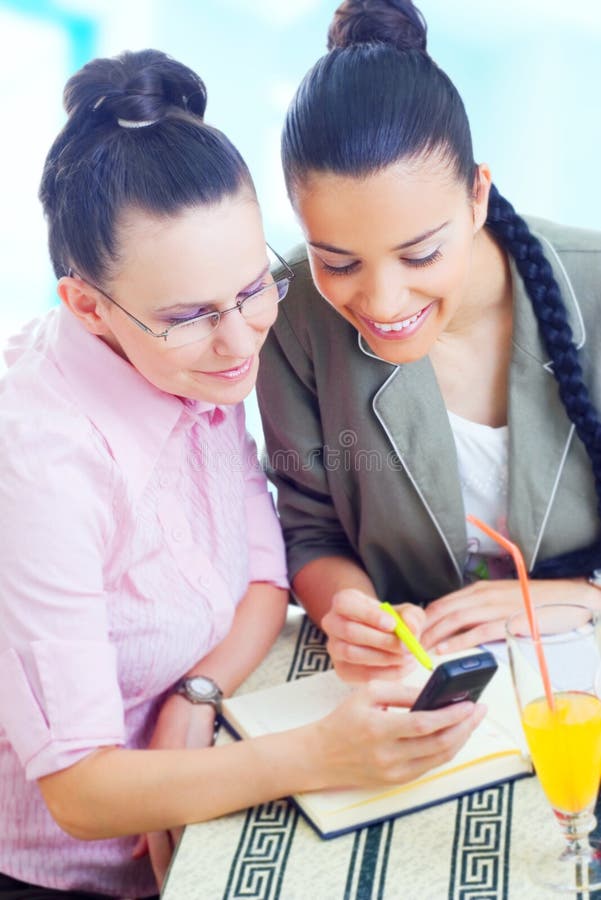 Two young businesswomen working