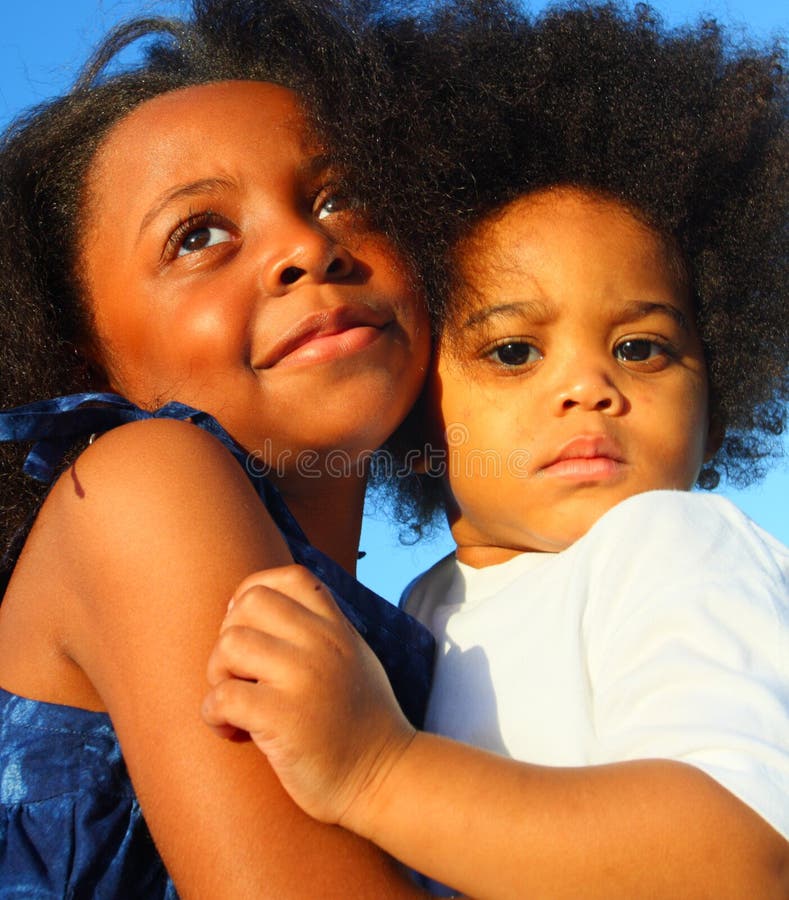 Two Young Children Hugging