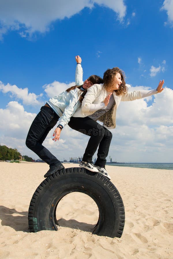 Two young girls having fun at the seaside