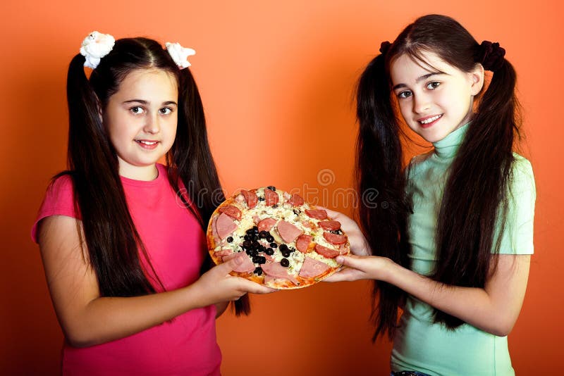 Two Young Girls with One Pizza Stock Photo Image of caucasian, finger