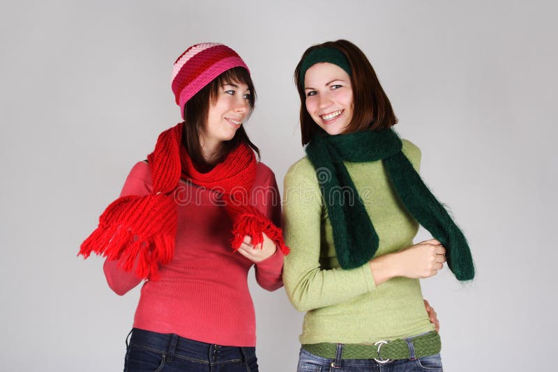 Two young girls in warm scarfs and hats