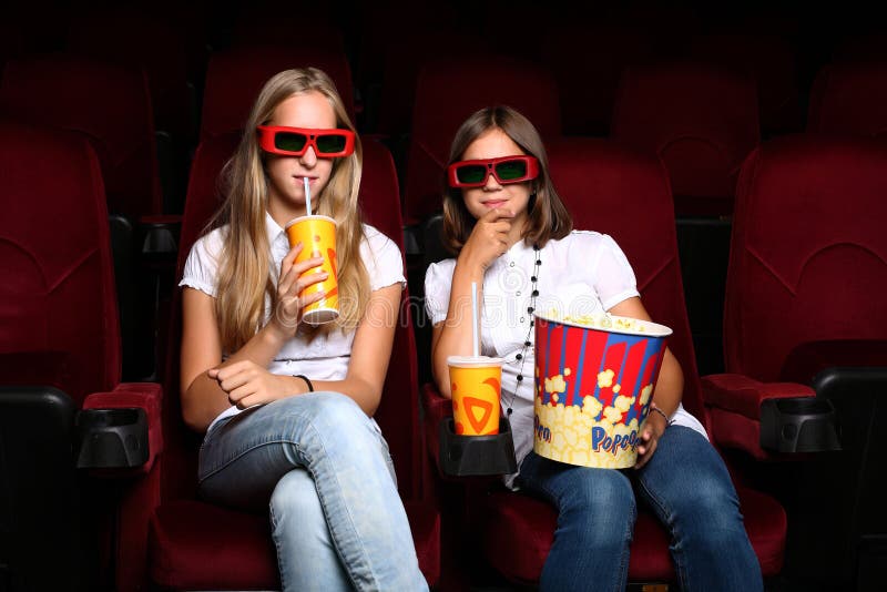 Two Young Girls Watching in Cinema Stock Photo Image of film