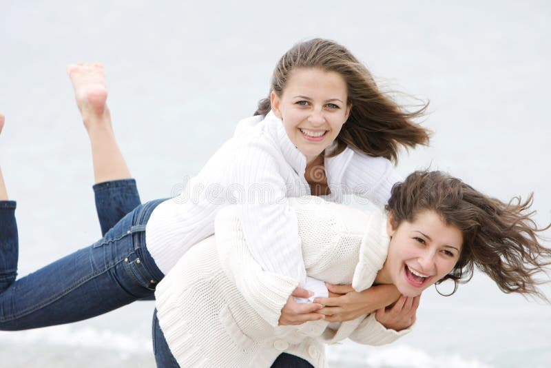 Two young happy girls on nature