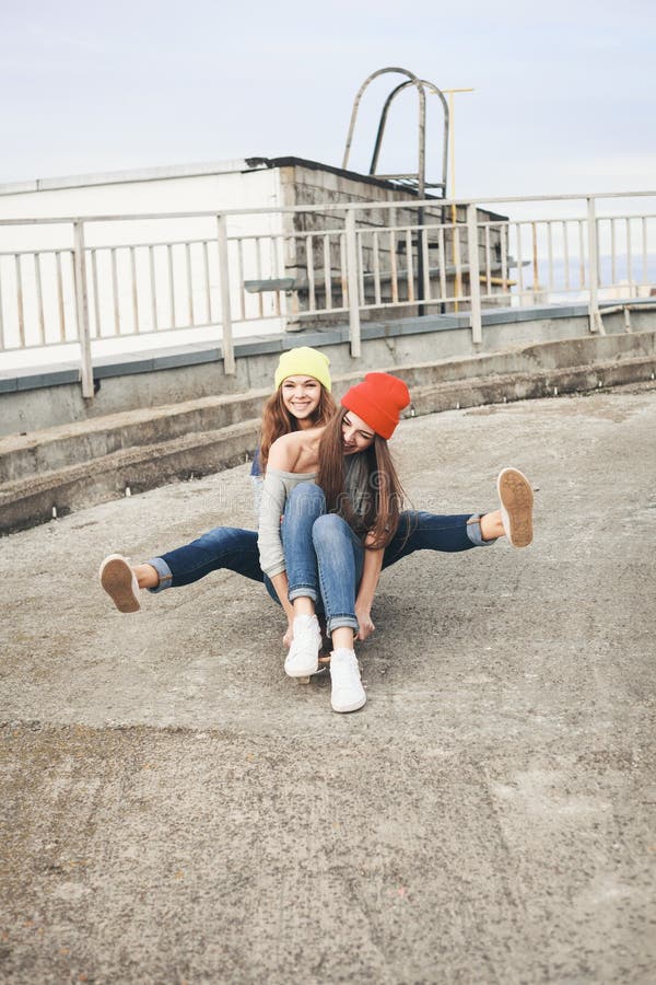 Two Young Longboarding Girl Friends Stock Image - Image of happy ...