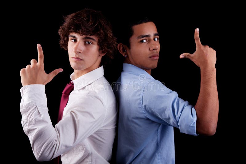 Two young man of different colors, back to back royalty free stock photos Two young man of different colors, back to back royalty free stock photos