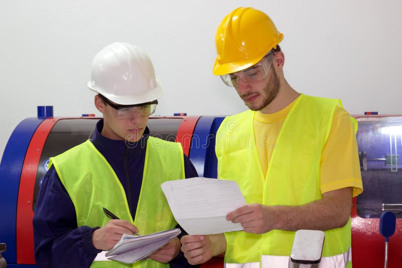 Two young mechanical workers stock photos Two young mechanical workers stock photos