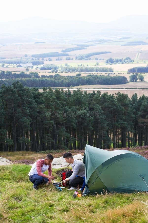 Two Young Men on Camping Trip in Countryside Stock Image Image of