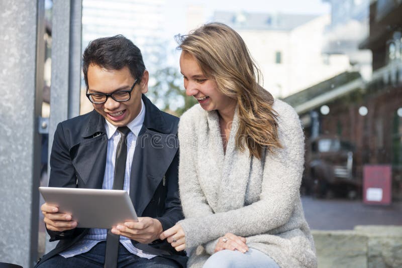 Two young people with digital tablet royalty free stock image Two young people with digital tablet royalty free stock image