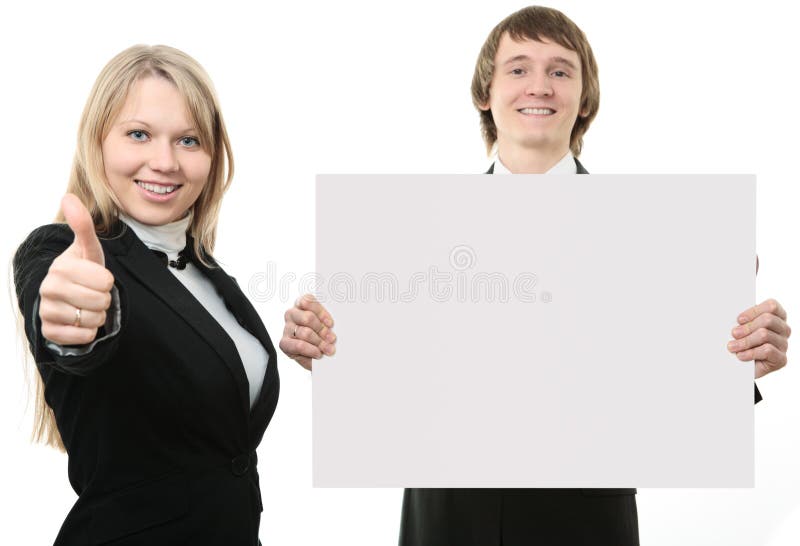 Two young people holding a white sign