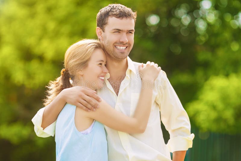 Two young Smiling Happy Lovers Spending Their Time in Summer For