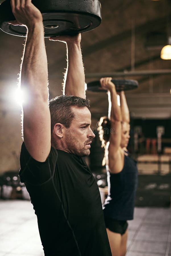Two strong people working out in gym royalty free stock image Two strong people working out in gym royalty free stock image