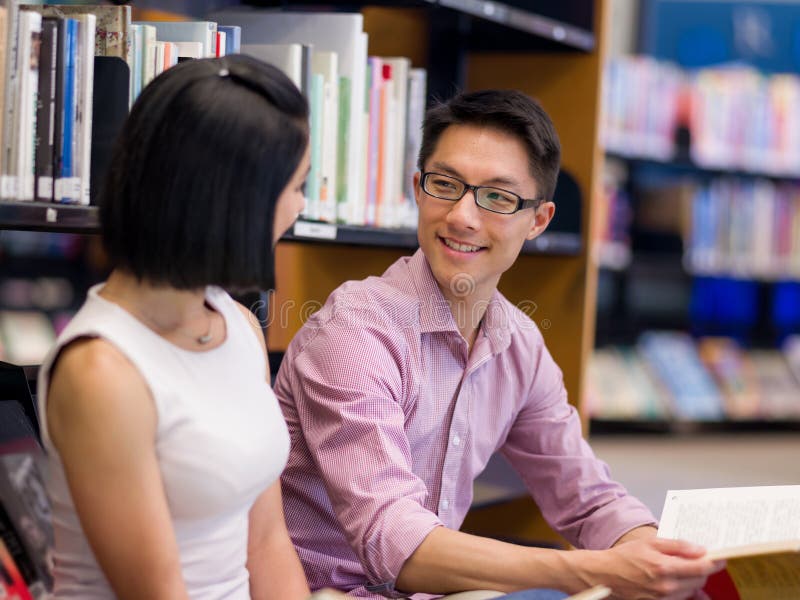 Two young students at the library