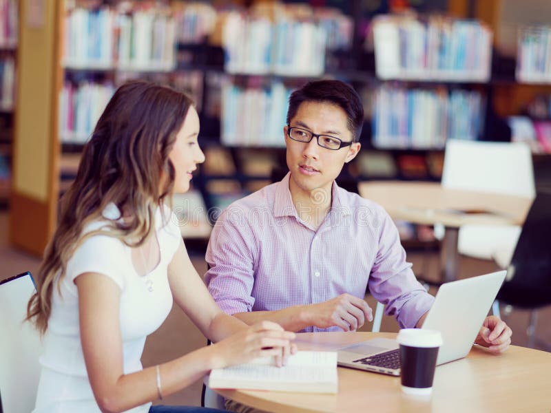 Two young students at the library