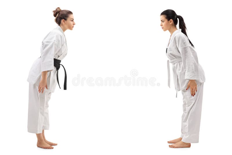 Two young women dressed in kimonos bowing to each other royalty free stock image Two young women dressed in kimonos bowing to each other royalty free stock image