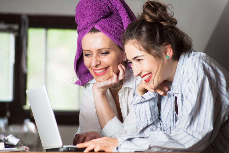 Two young women surfing the internet stock images Two young women surfing the internet stock images