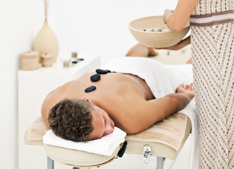 Young man enjoying the treatment in spa salon. Young man enjoying the treatment in spa salon