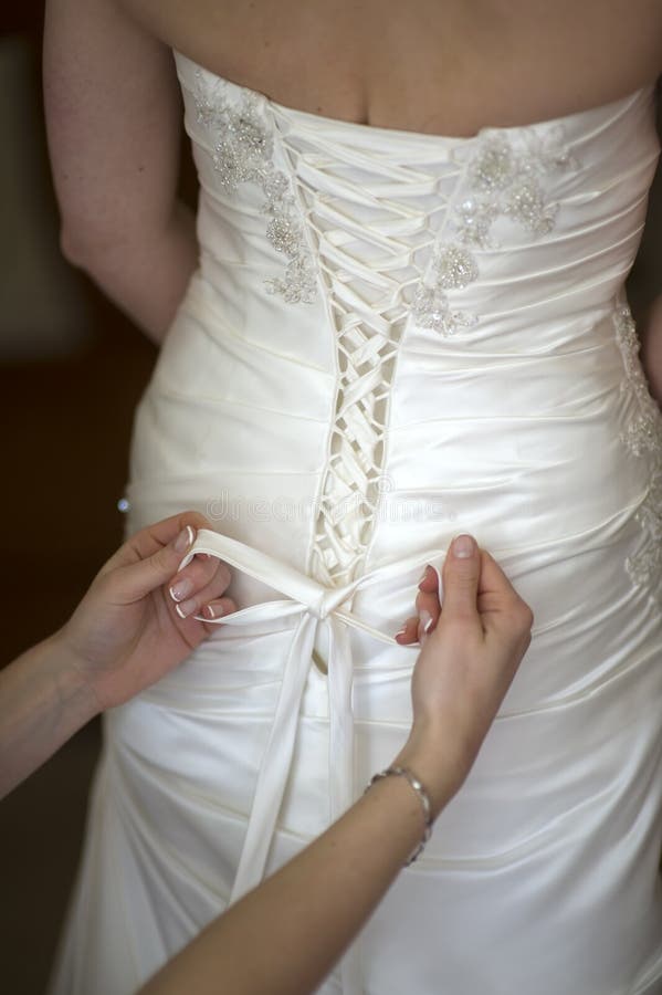 Tying the Bow on a Wedding Dress Stock Photo Image of knot, hands
