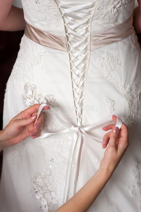 Tying the Bow on a Wedding Dress Stock Photo Image of knot, hands