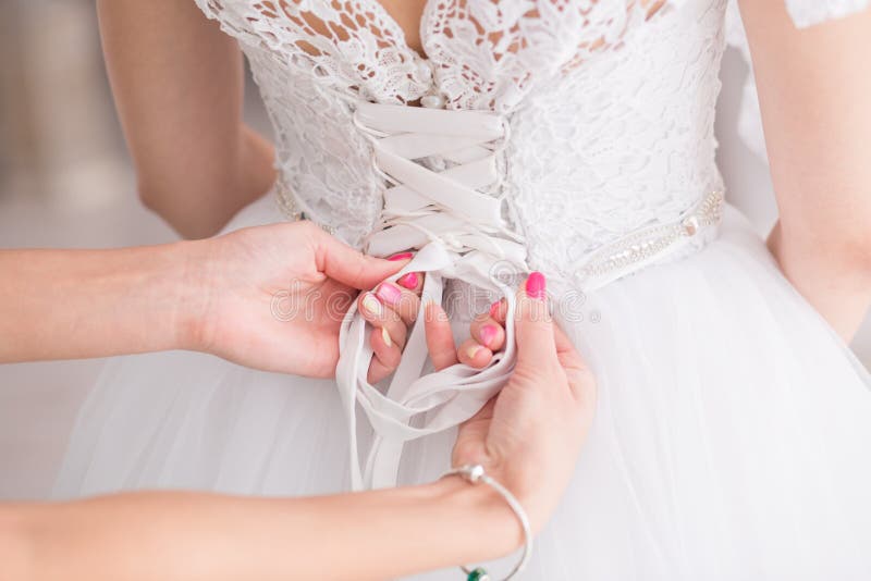 Tying Ribbons on a Wedding Dress Stock Photo Image of female, beauty 66505052