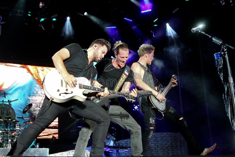 NASHVILLE-JUL 11: Country recording artist Tyler Hubbard C and Brian Kelley (R) of Florida Georgia Line perform during Luke Bryan's 'Kick The Dust Up' Tour at Vanderbilt Stadium on July 11, 2015 in Nashville, Tennessee. NASHVILLE-JUL 11: Country recording artist Tyler Hubbard C and Brian Kelley (R) of Florida Georgia Line perform during Luke Bryan's 'Kick The Dust Up' Tour at Vanderbilt Stadium on July 11, 2015 in Nashville, Tennessee.