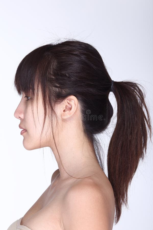 Rear Side View of asian woman black hair, studio lighting white background. Rear Side View of asian woman black hair, studio lighting white background