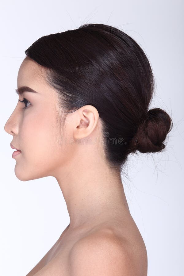 Rear Side View of asian woman black hair, studio lighting white background. Rear Side View of asian woman black hair, studio lighting white background