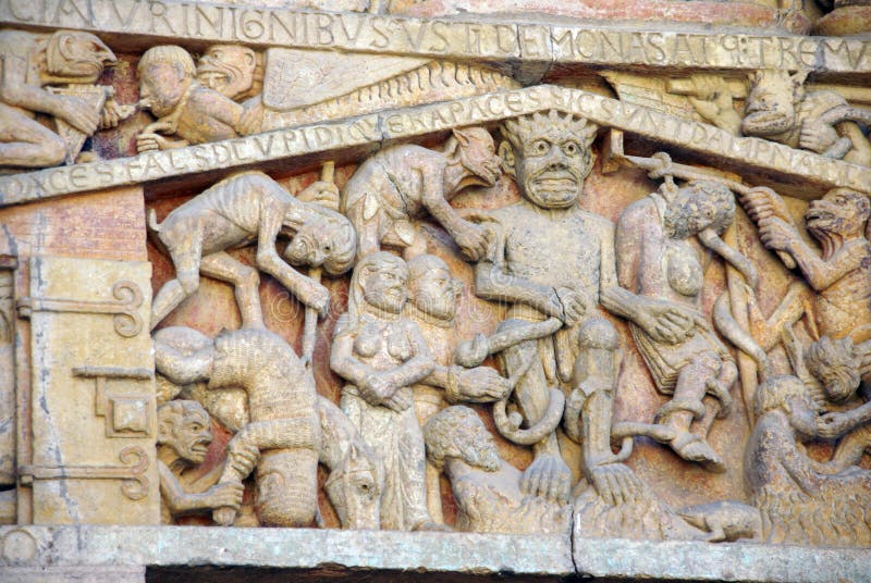 Tympanum carvings of the Last Judgment from the 13th century, Abbey Church of St. Foy, Conques, France. Medieval tympanum stock images, royalty-free photos and pictures