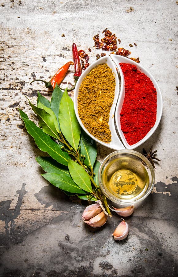 Bay Leaves with Garlic, Pepper and Olive Oil on a Stone Stand. Stock Image Image of garlic