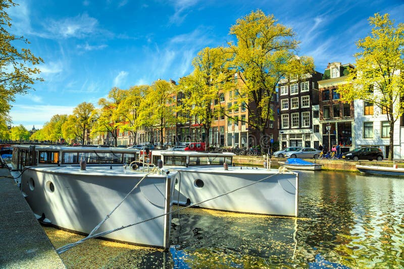 Typical Amsterdam canals with boats and harbors, Netherlands, Europe stock images Typical Amsterdam canals with boats and harbors, Netherlands, Europe stock images