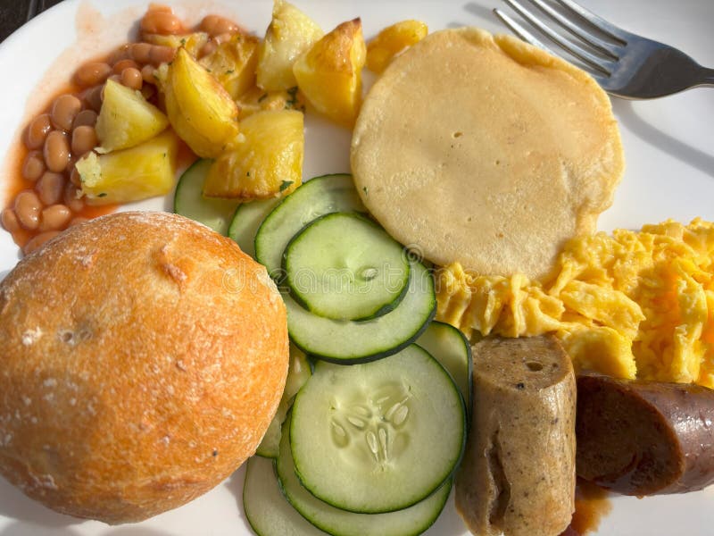 A typical breakfast at the hotel with egg, beans stock photos