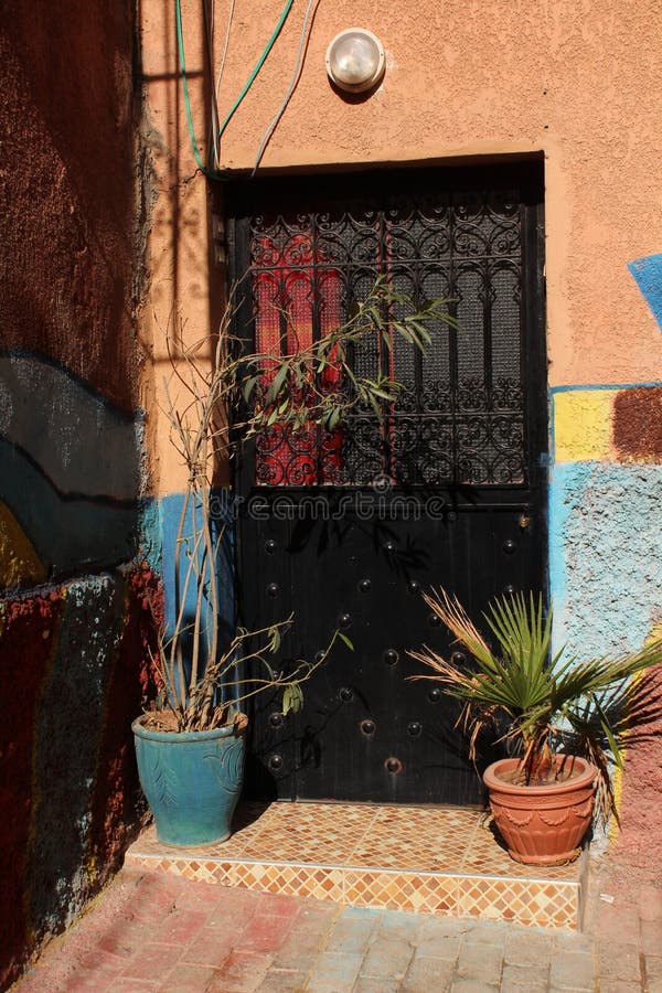 Typical door of a city house in medina - historical centre of Marrakesh stock photo Typical door of a city house in medina - historical centre of Marrakesh stock photo