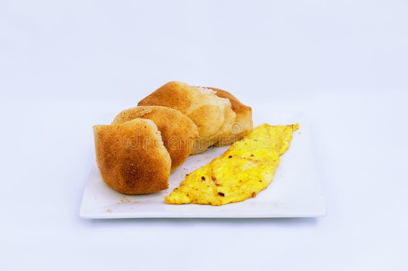 Typical Filipino Breakfast, Pandesal Crusted Bread and Scrambled Egg on