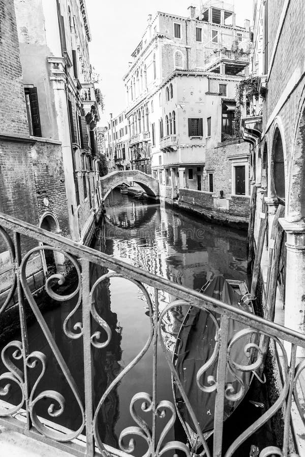 Typical Gondola in a Narrow Venetian Canal. Traditional Italian ...