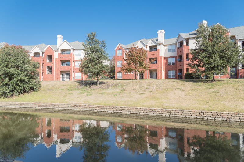 Typical Multistory Riverside Apartment Complex with Fall Foliage in