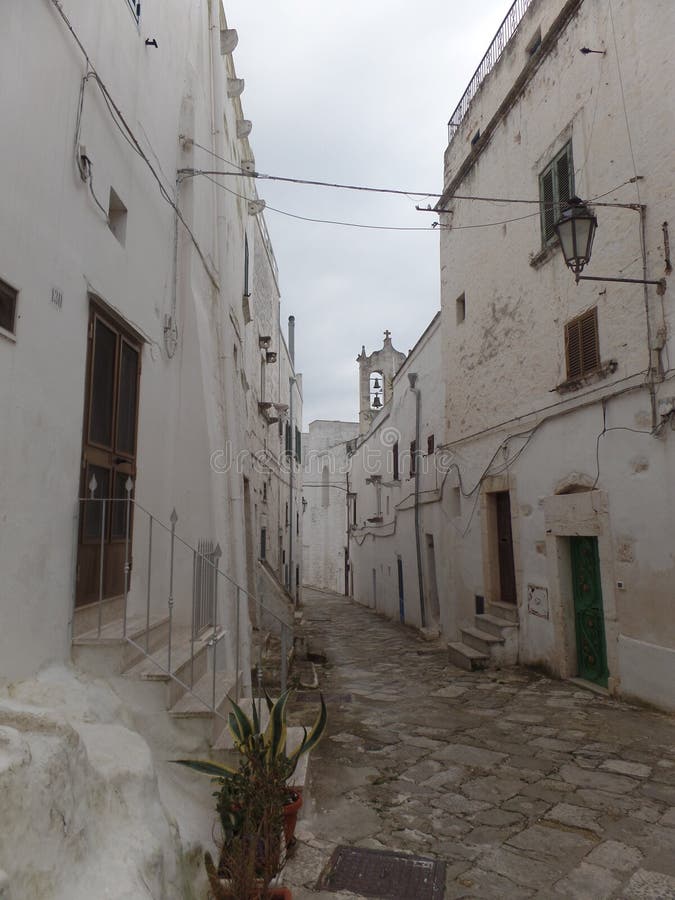 Typical street of white washed houses in Ostuni, Puglia, Italy royalty free stock photo Typical street of white washed houses in Ostuni, Puglia, Italy royalty free stock photo