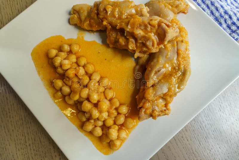 Typical Spanish Dish, Braised Pork Feet with Chickpeas Stock Photo Image of macro, eatery