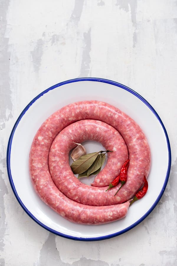 Typical Spanish Sausage on White Dish on Ceramic Background Stock Photo