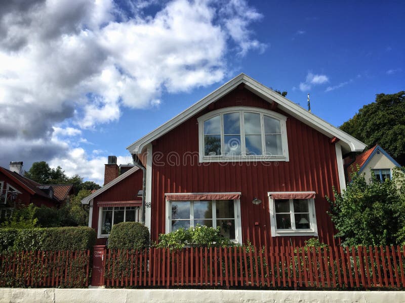 A Typical Swedish Small Wooden Residential House Painted in Traditional