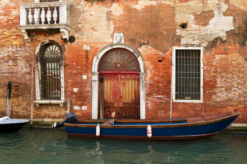 Typical Facade in Venice with Decorative Flowers. Stock Photo Image