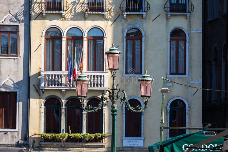 Typical Venice Lamp Post with Old Building on Background Stock Image