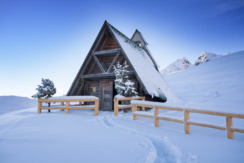 Typical wooden chalet in the Dolomites mountain