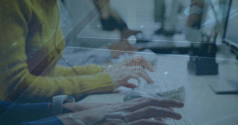 Typing hands in sweater sleeves on keyboards in open-plan office, with data overlays stock photos