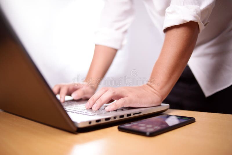 Typing on Notebook stock photo