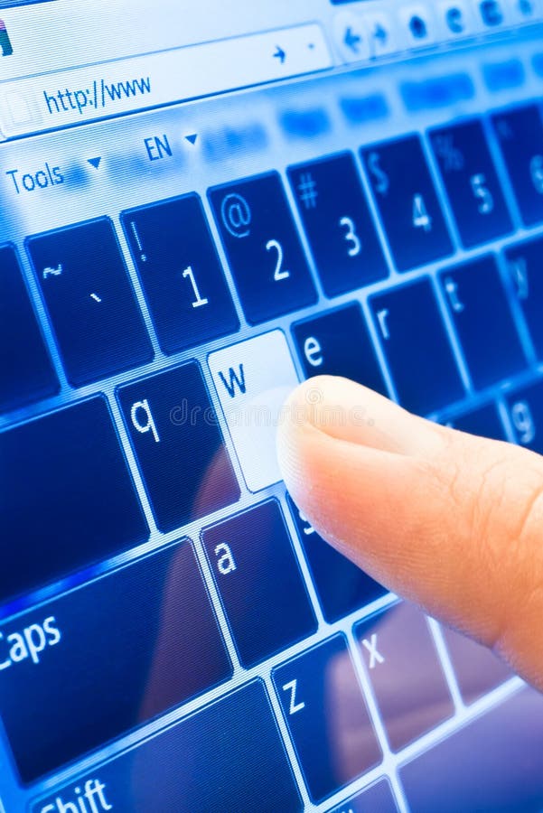 Typing on touch screen stock photo