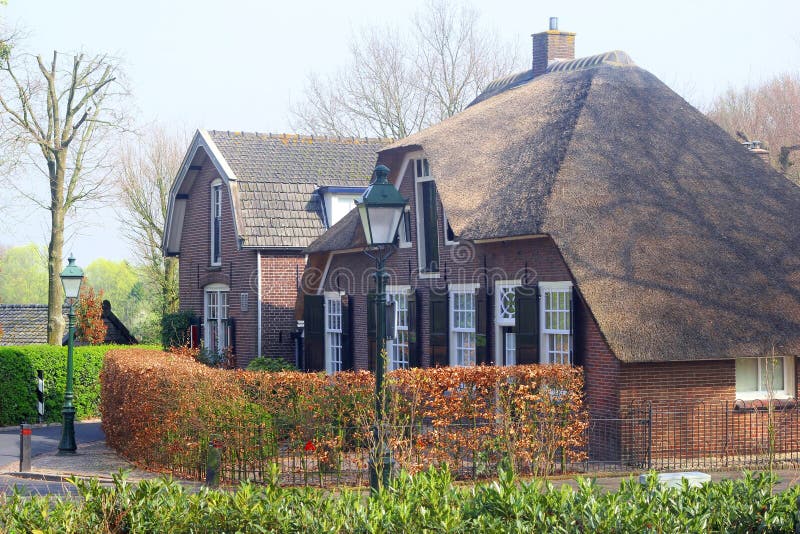 Dutch historical houses with thatched roofs and with old tiles, Soest, Netherlands. Dutch historical houses with thatched roofs and with old tiles, Soest, Netherlands